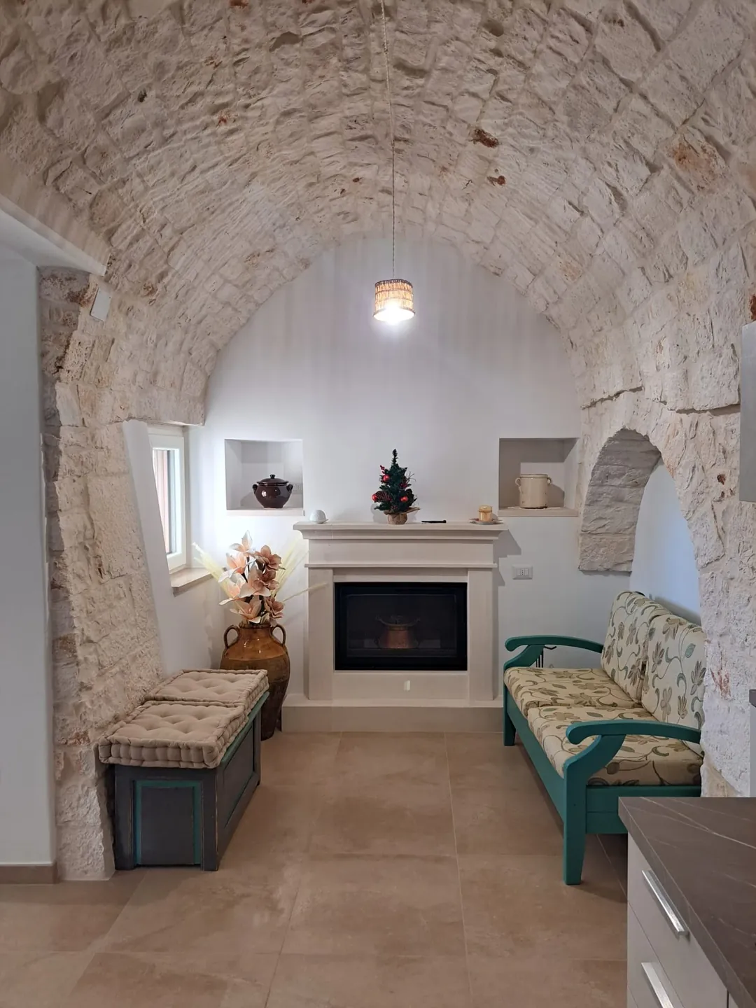 Cozy living room with typical Apulian stone fireplace